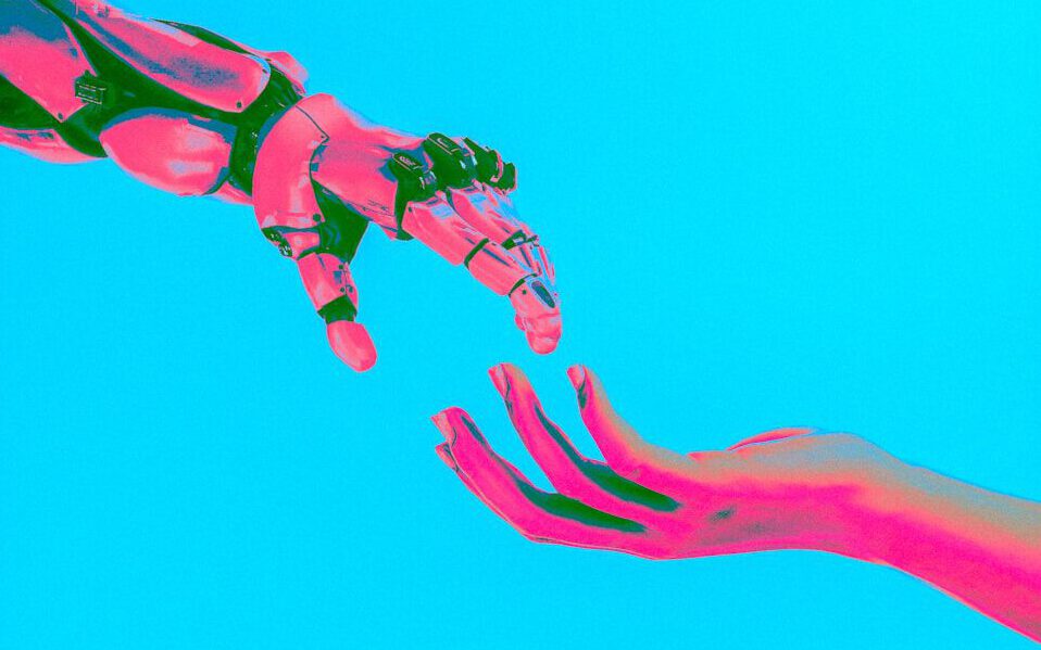 two hands reaching for a flying object in the sky